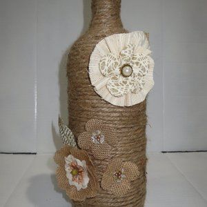 X LARGE JUTE WRAPPED WINE BOTTLE. BURLAP FLOWERS.